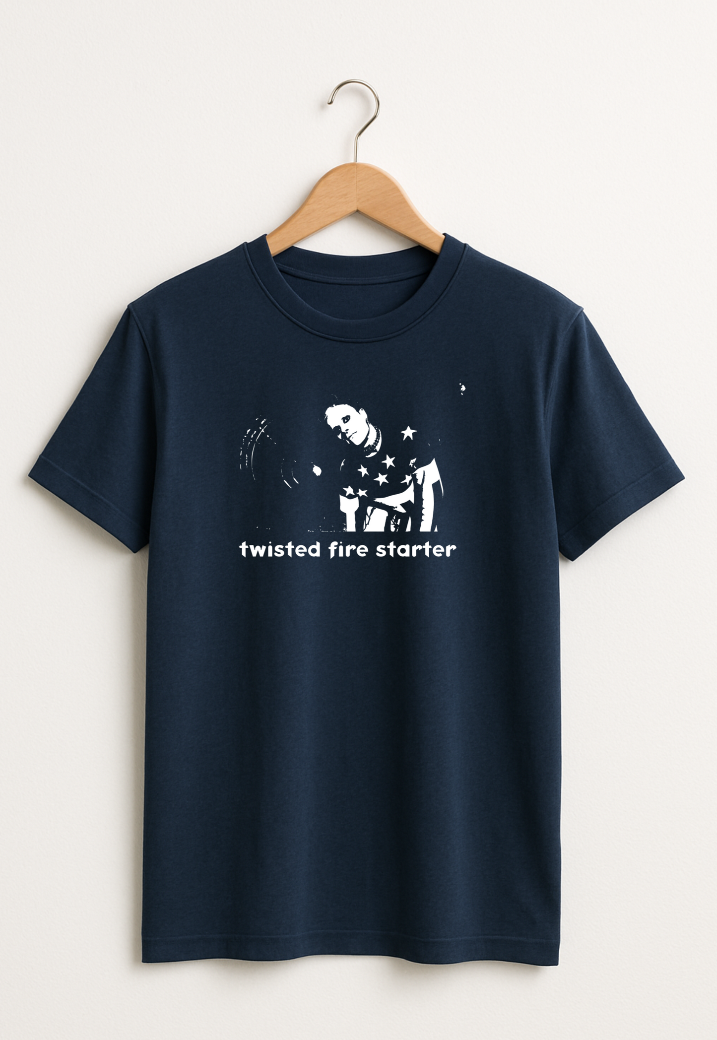Navy blue t-shirt with white graphic and text 'twisted fire starter' on a hanger against a white background
