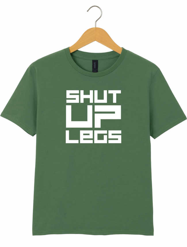 Green t-shirt with 'SHUT UP LEGS' text on a hanger against a white background