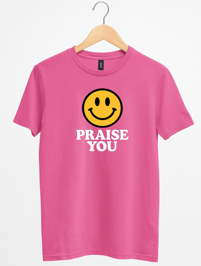 Pink t-shirt with smiley face and 'PRAISE YOU' text on a hanger against a white background