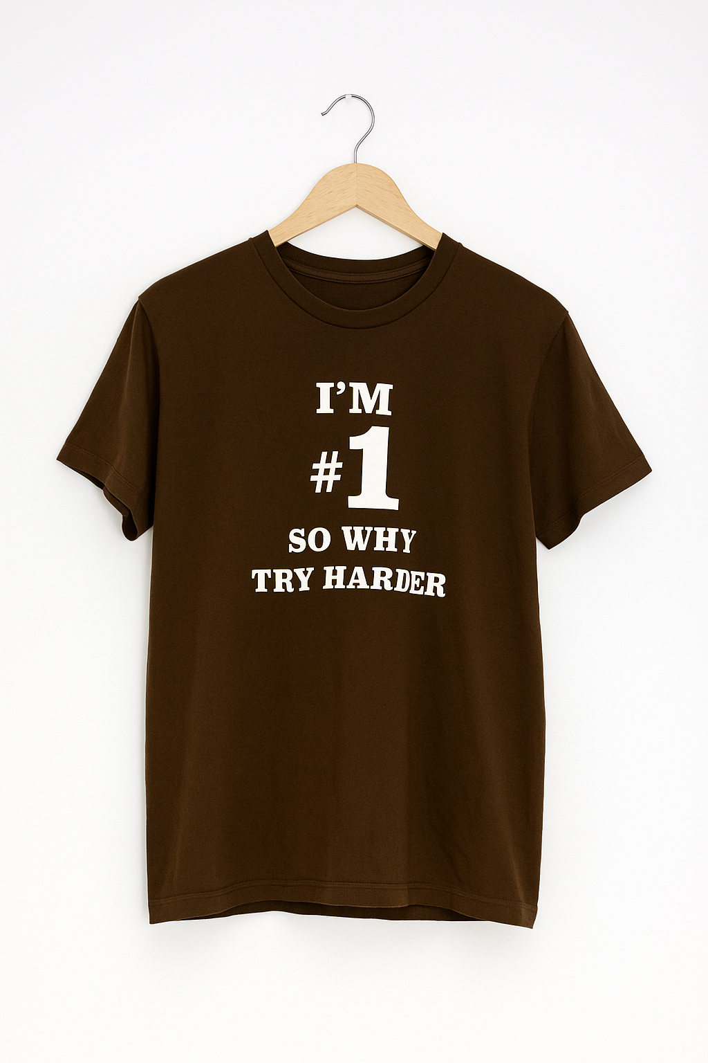 Brown t-shirt with white text on a hanger against a white background