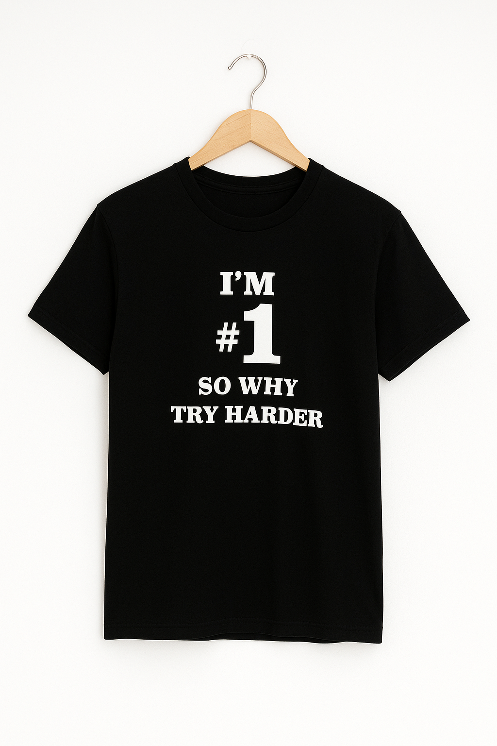 Black t-shirt with white text on a hanger against a white background
