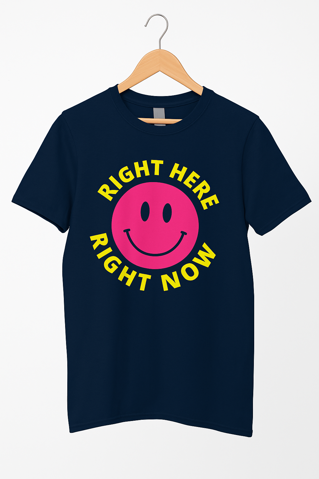 Navy blue t-shirt with a pink smiley face and yellow text on a hanger against a white background