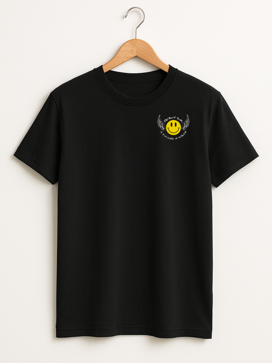 A black short-sleeve crewneck t-shirt hanging on a wooden hanger against a light beige wall. The shirt features a small yellow smiley face graphic with black wings and text on the left chest.