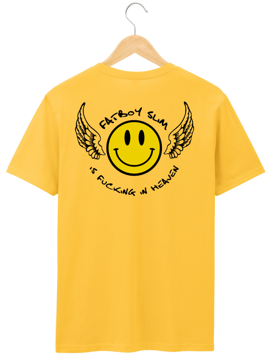 A yellow short-sleeve t-shirt hanging on a wooden hanger against a white background, featuring a black graphic of a winged smiley face with the text 'FATBOY SLAM' and 'IS FUCKING IN HEAVEN'.