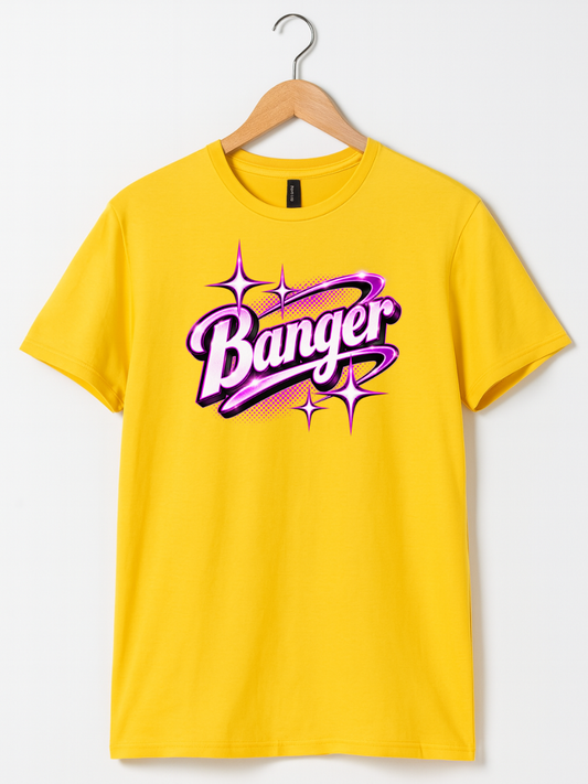 A bright yellow short-sleeve t-shirt hanging on a wooden hanger against a light gray background. The shirt features a large graphic on the chest with the word 'Banger' in stylized purple and pink bubble lettering surrounded by pink starburst sparkles.