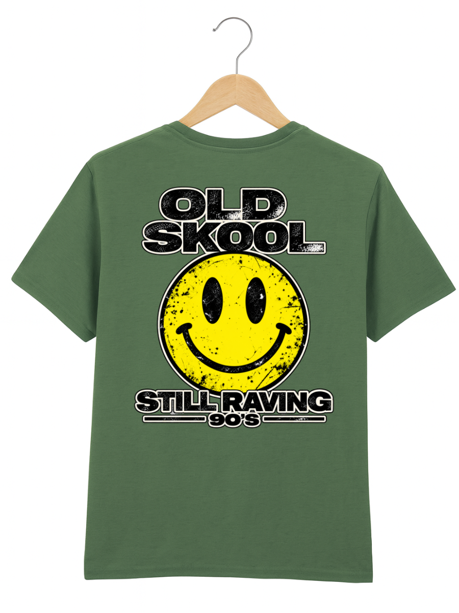 A green short-sleeve t-shirt hanging on a wooden hanger against a white background, featuring a distressed yellow smiley face graphic with the text 'OLD SKOOL' above and 'STILL RAVING 90's' below.