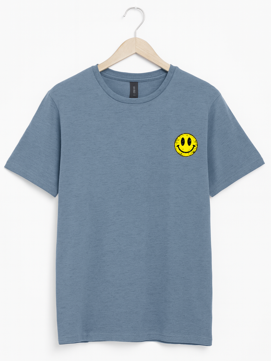 A blue crewneck t-shirt hanging on a wooden hanger against a clean white background. The shirt features a small yellow smiley face graphic on the left chest.
