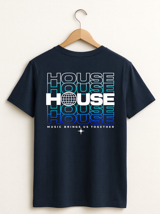 A navy blue short-sleeve t-shirt hanging on a wooden hanger against a light beige wall. The back of the shirt features a large graphic print with the word 'HOUSE' repeated in stacked, fading text (from cyan to blue to purple) in white and blue outlines, with 'MUSIC BRINGS US TOGETHER' printed below.