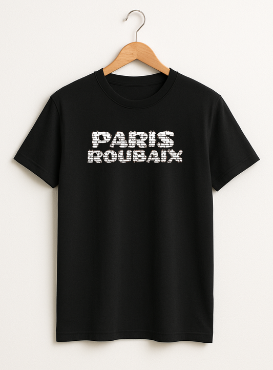 Black t-shirt with 'PARIS ROUBAIX' text on a hanger against a white background