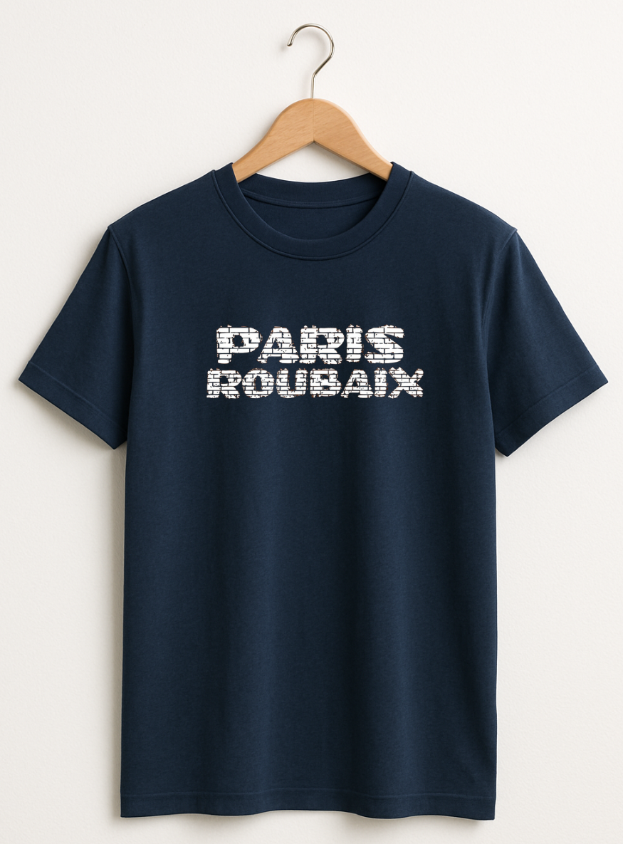 Navy blue t-shirt with 'PARIS ROUBAIX' text on a hanger against a white background