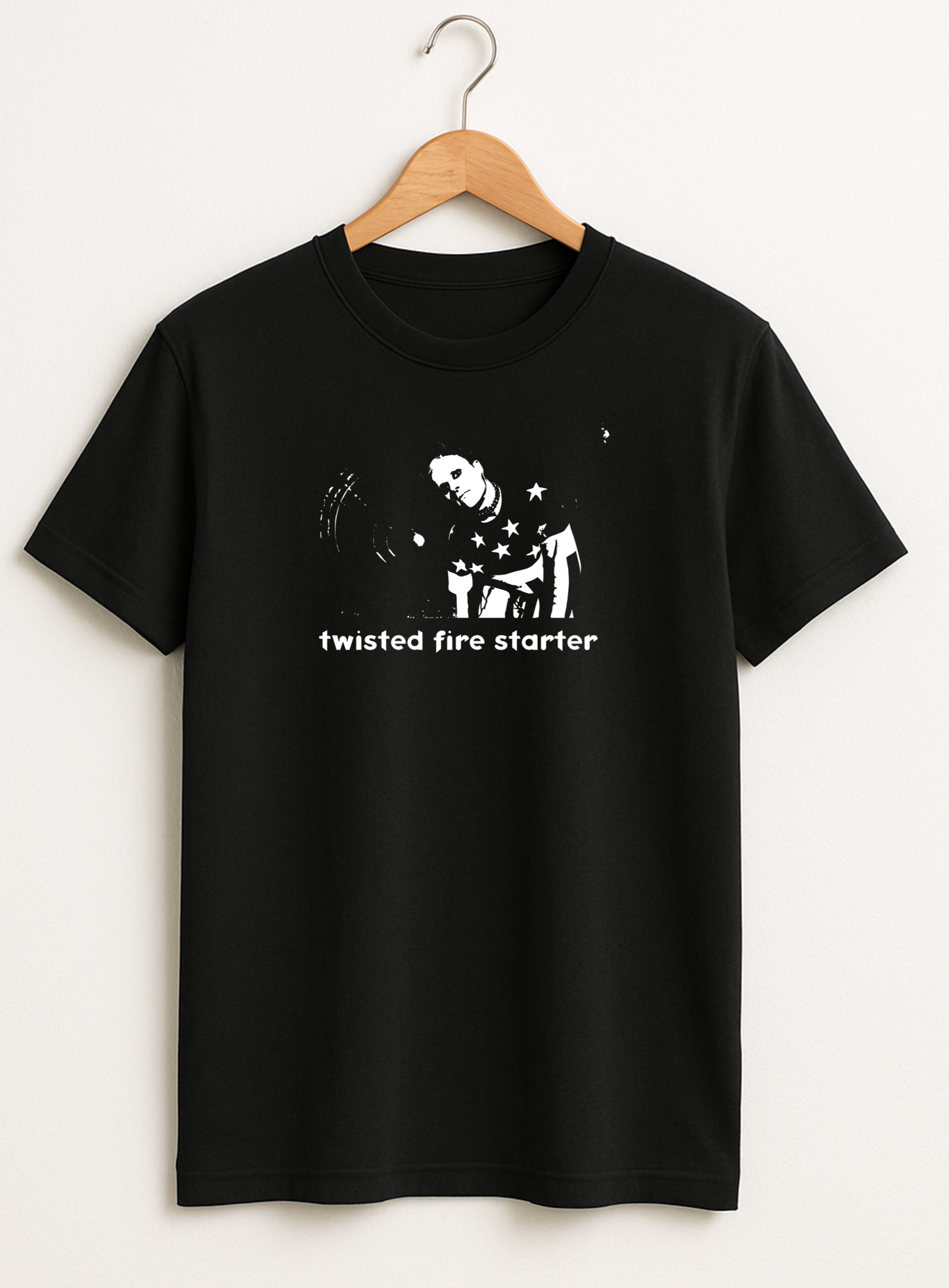 Black t-shirt with white graphic and text 'twisted fire starter' on a hanger against a white background