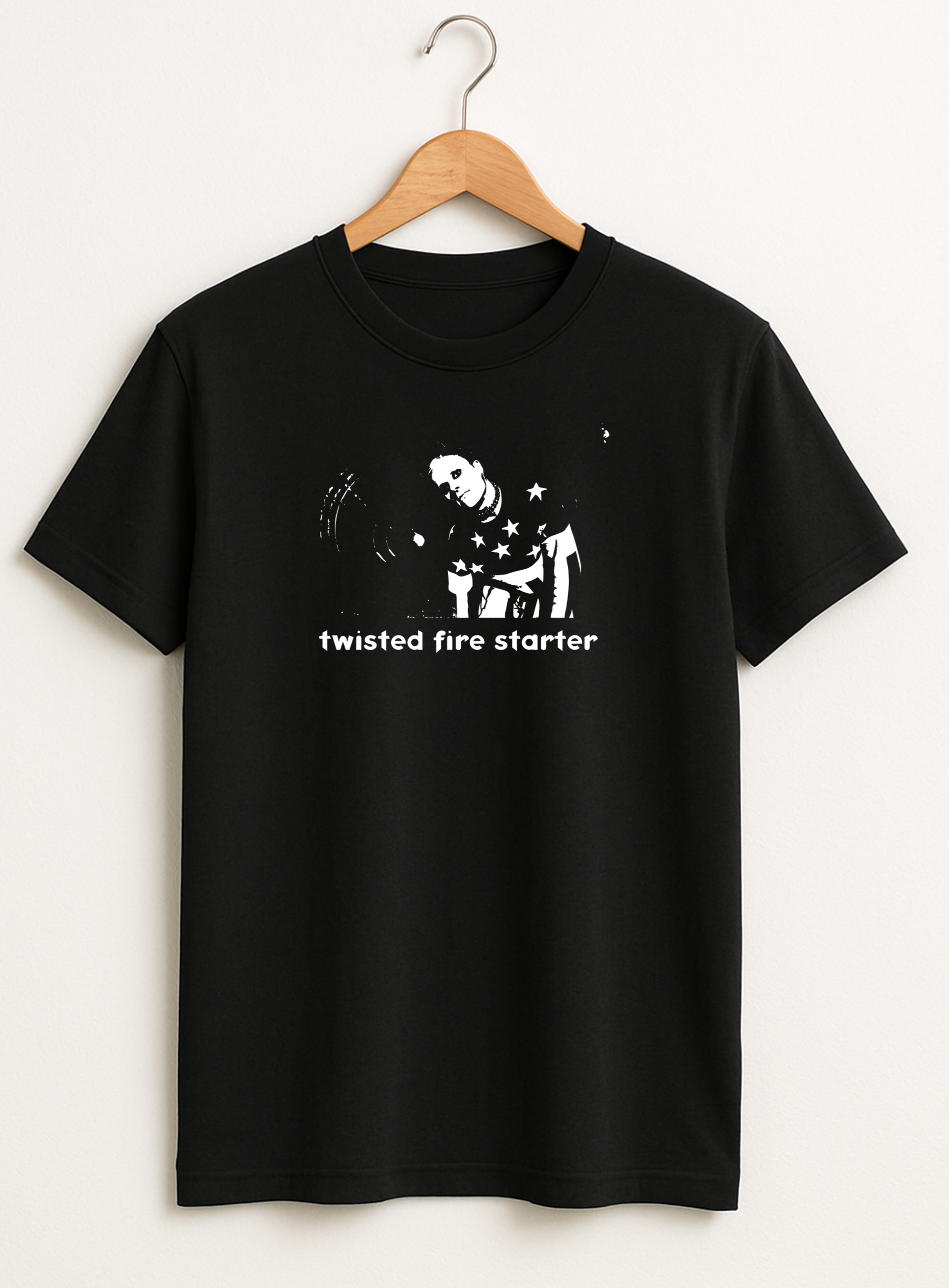 Black t-shirt with white graphic and text 'twisted fire starter' on a hanger against a white background