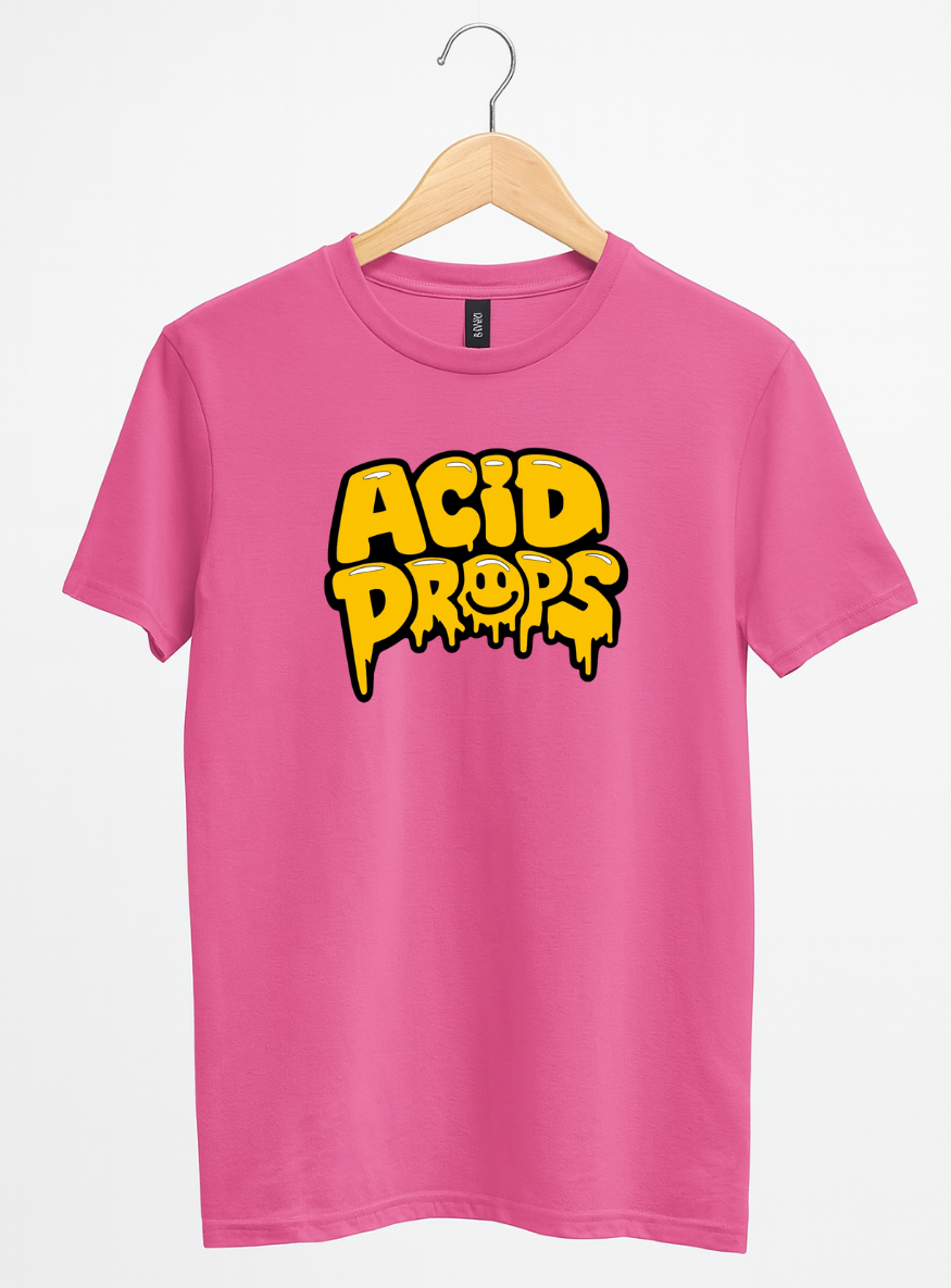Pink t-shirt with yellow 'ACID DROPS' text on a hanger against a white background