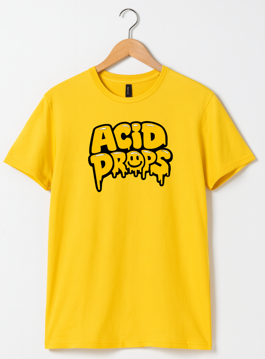 Yellow t-shirt with 'ACID DROPS' text on a hanger against a white background