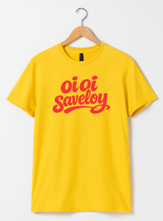 Yellow t-shirt on a wooden hanger featuring bold red script text reading “Oi Oi Saveloy” on the front.