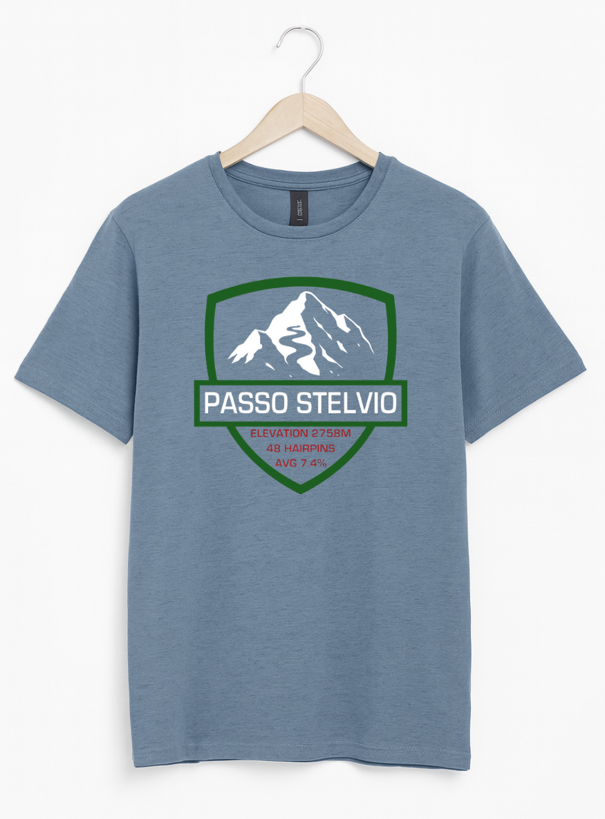 Blue t-shirt with mountain graphic and 'Passo Stelvio' text on a hanger against a white background