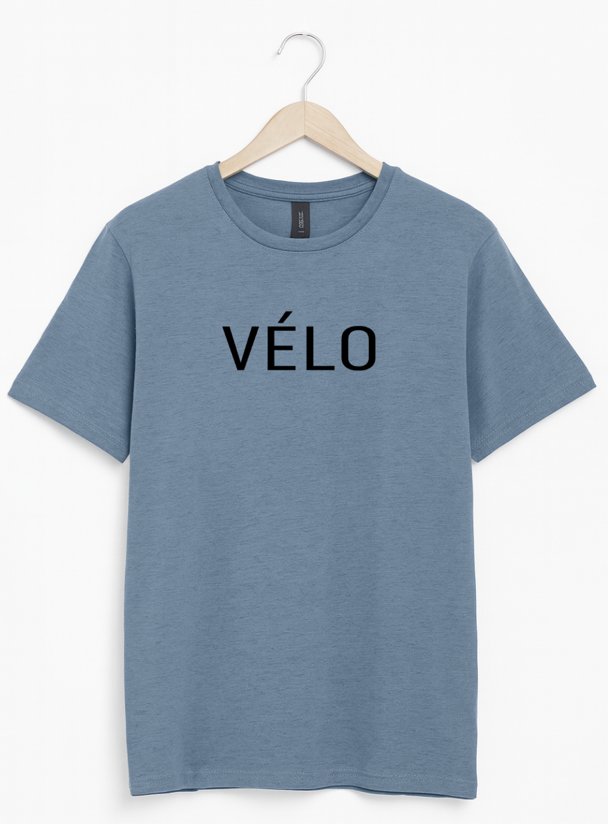 Blue t-shirt with 'Vélo' text on a hanger against a white background