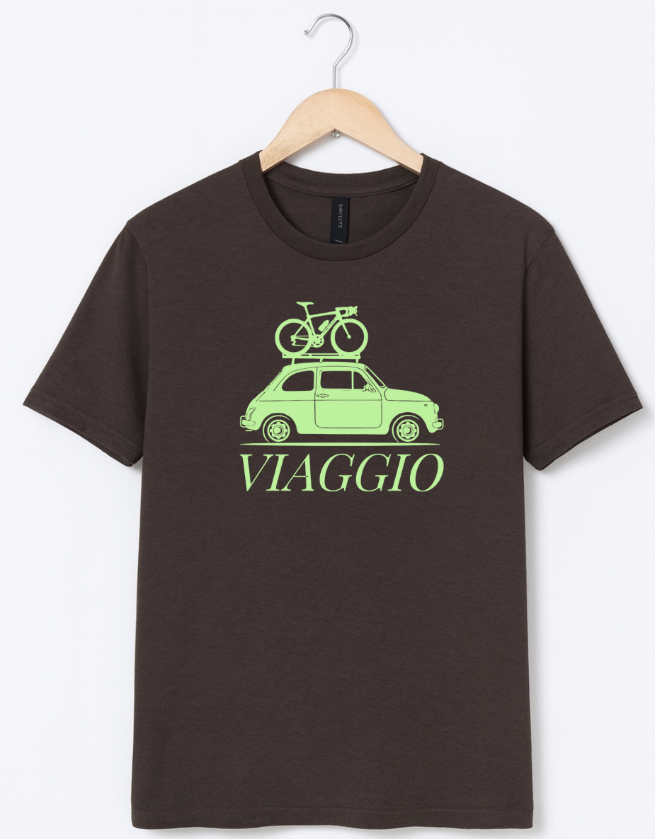 Brown t-shirt featuring a mint green graphic of a vintage car with a bicycle on the roof and the word “Viaggio” printed below.