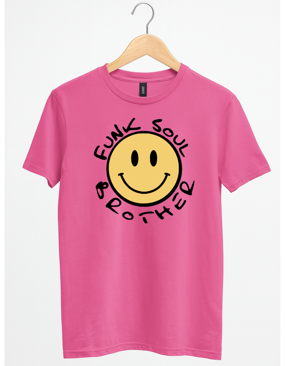 Pink t-shirt with a smiley face and text on a hanger against a white background