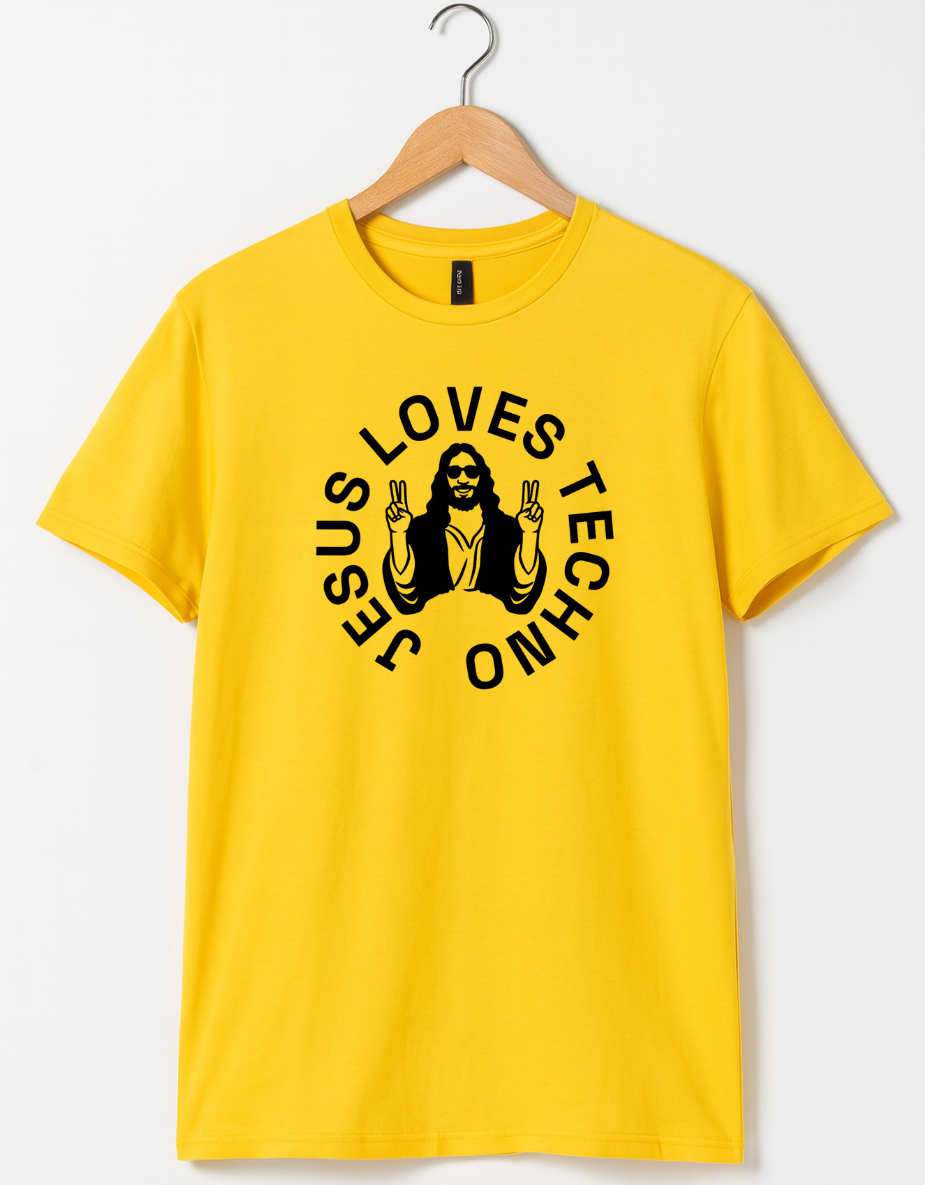 Yellow  t-shirt on a wooden hanger featuring a white “Jesus Loves Techno” graphic with a stylized illustration of Jesus wearing sunglasses and making peace signs.