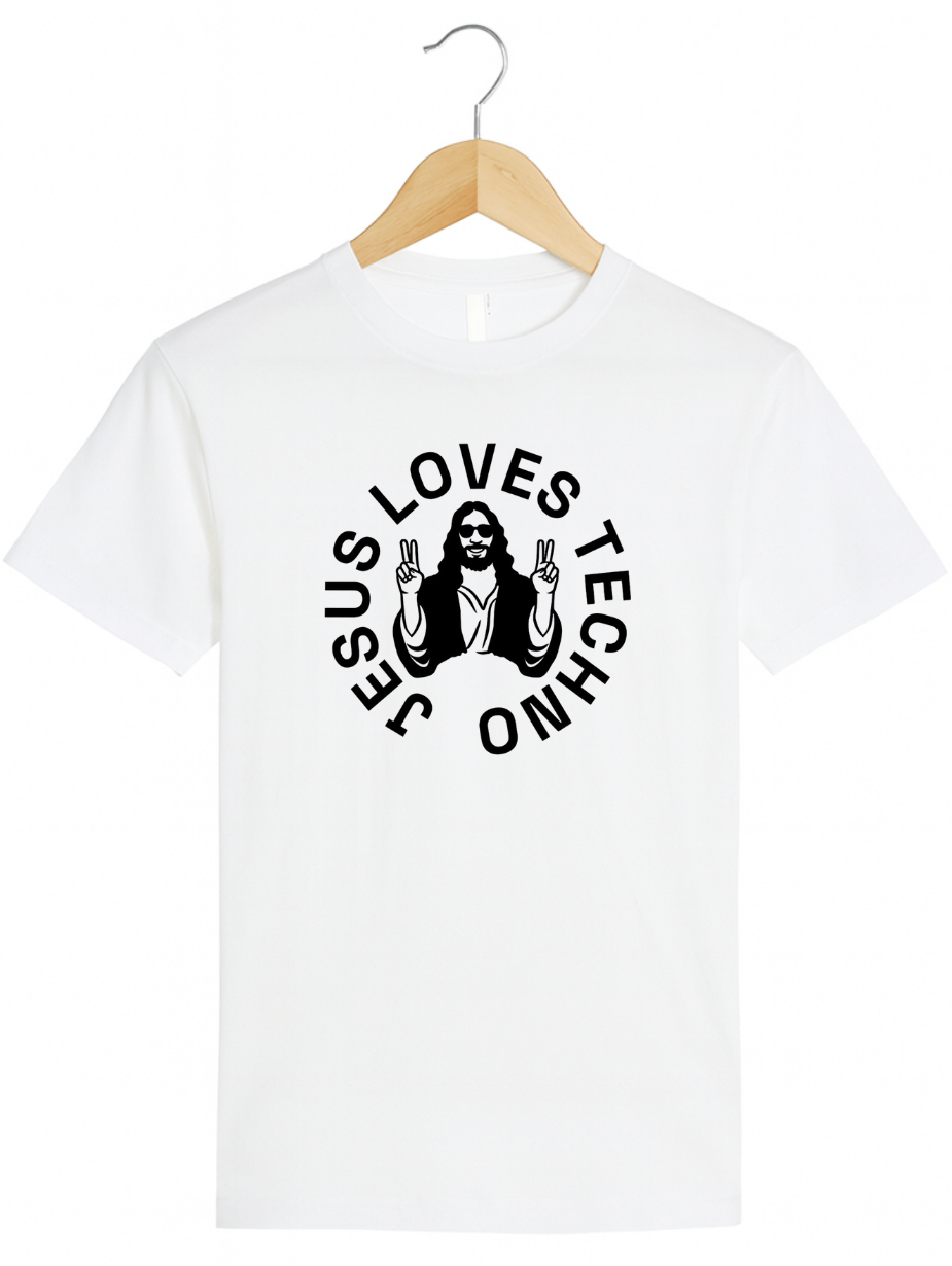 White t-shirt on a wooden hanger featuring a white “Jesus Loves Techno” graphic with a stylized illustration of Jesus wearing sunglasses and making peace signs.