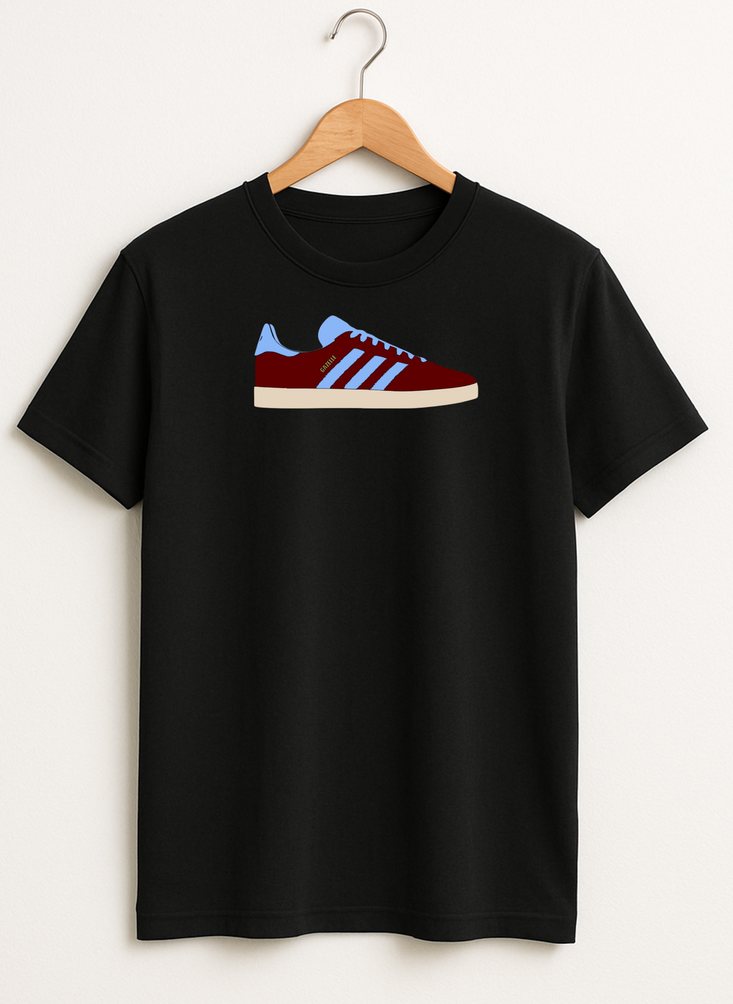 Black t-shirt with a graphic of red and blue sneakers on a hanger against a white background
