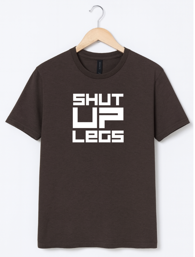 Brown t-shirt with 'SHUT UP LEGS' text on a hanger against a white background