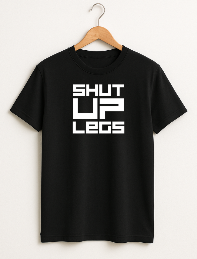Black t-shirt with 'SHUT UP LEGS' text on a hanger against a white background