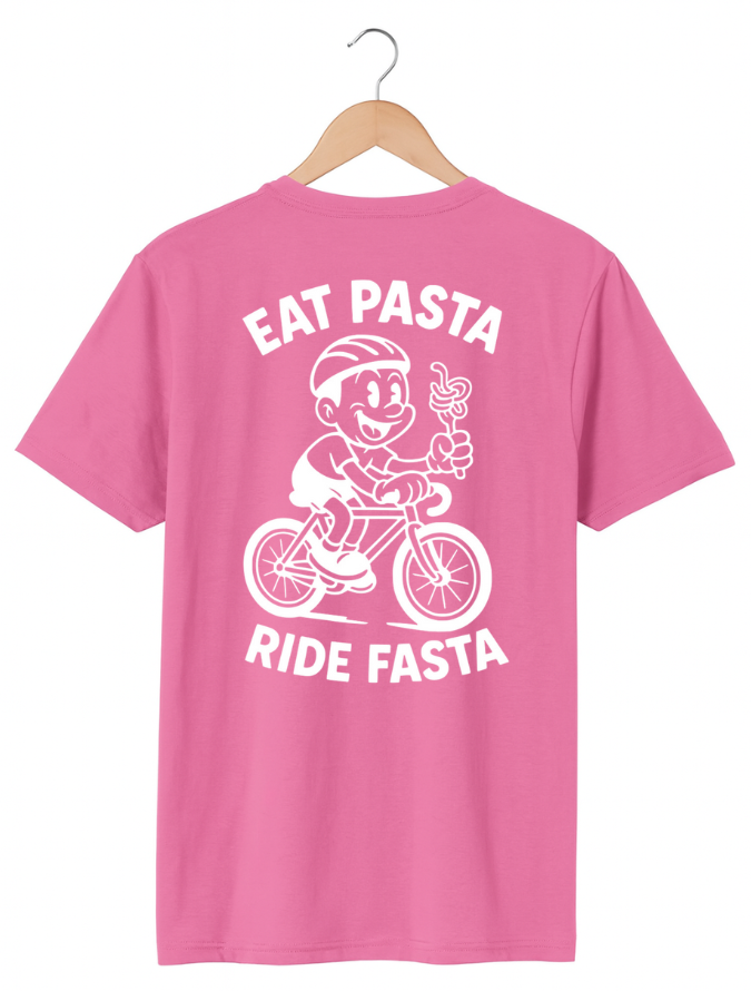 Pink t-shirt with a graphic of a cyclist riding a bike and text 'Eat Pasta Ride Fasta' on a hanger.