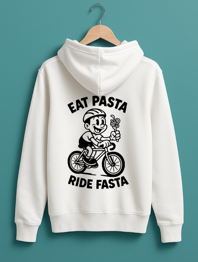 white hoodie hanging on a wooden hanger with a white graphic of a cartoon cyclist holding pasta and the text “Eat Pasta Ride Fasta” on the back.