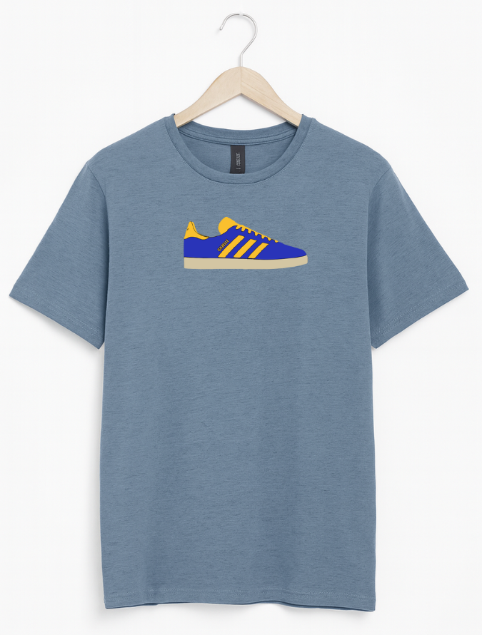 Blue t-shirt with a shoe graphic on a hanger against a white background