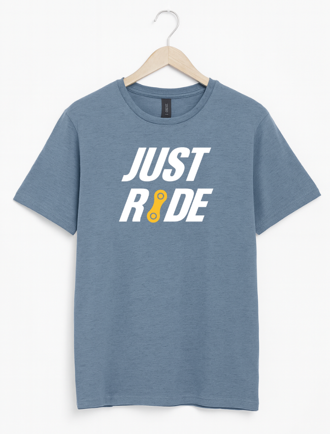 Blue t-shirt with 'JUST RIDE' text on a hanger against a white background