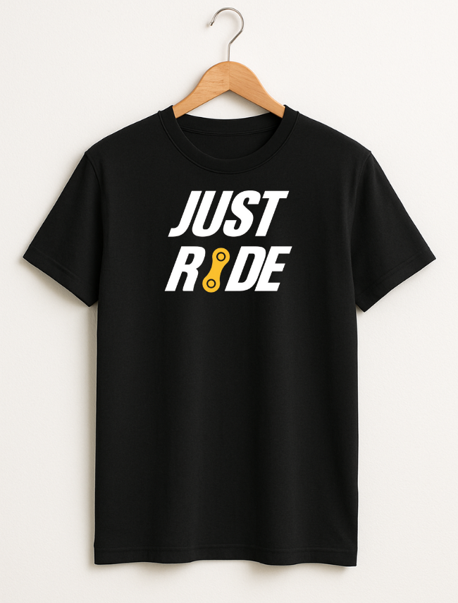 Black t-shirt with 'JUST RIDE' text on a hanger against a white background