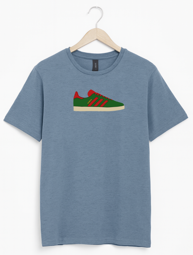 Blue t-shirt with a graphic of a green and red shoe on a hanger against a white background
