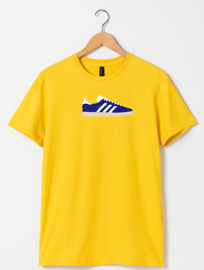 Yellow t-shirt with a blue and white sneaker graphic on a hanger against a white background