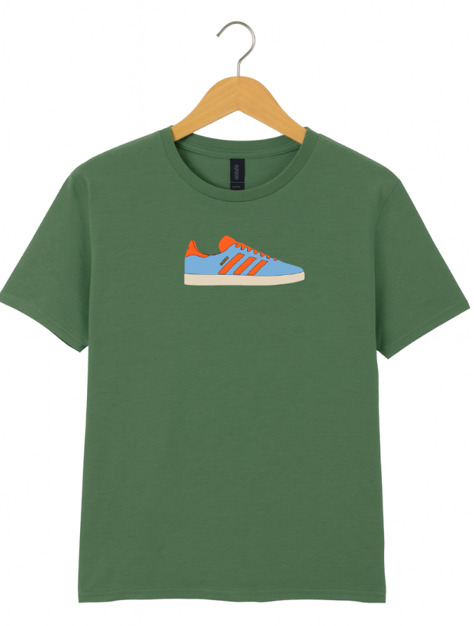 Green t-shirt with a shoe graphic on a hanger against a white background