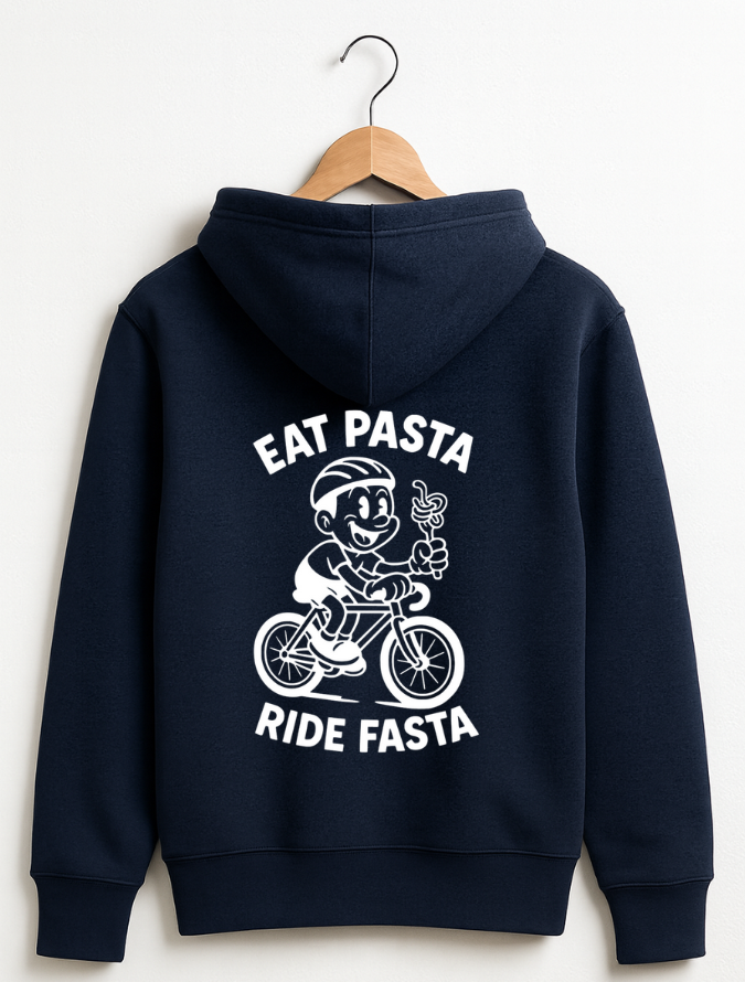 Navy blue hoodie hanging on a wooden hanger with a white graphic of a cartoon cyclist holding pasta and the text “Eat Pasta Ride Fasta” on the back.