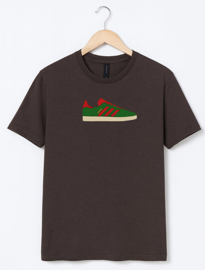 Brown t-shirt with a green and red sneaker graphic on a hanger against a white background