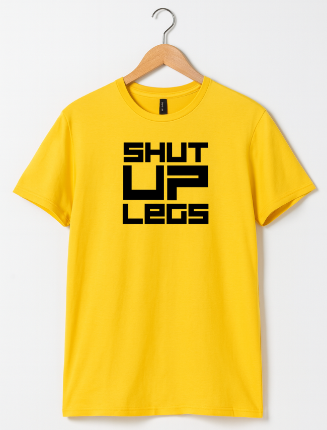 Yellow t-shirt with 'SHUT UP LEGS' text on a hanger against a white background