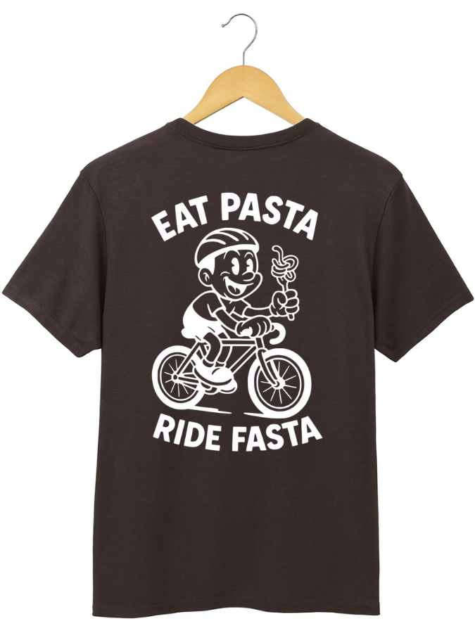 Black t-shirt with a graphic of a character riding a bike and text 'Eat Pasta Ride Fasta' on a hanger.