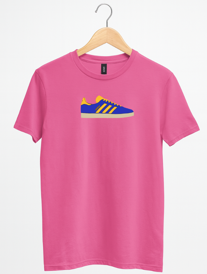 Pink t-shirt with a blue and yellow sneaker graphic on a hanger against a white background