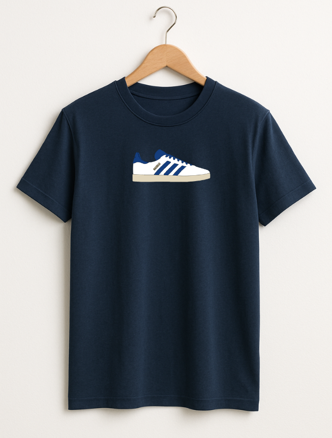 Navy blue t-shirt with a white and blue sneaker graphic on a hanger against a light gray background