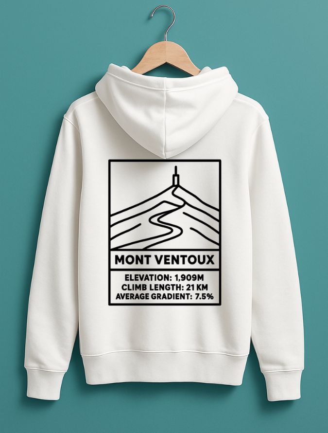 White hoodie hanging on a wooden hanger, featuring a black line-art graphic of Mont Ventoux with elevation, climb length, and average gradient details printed on the back.