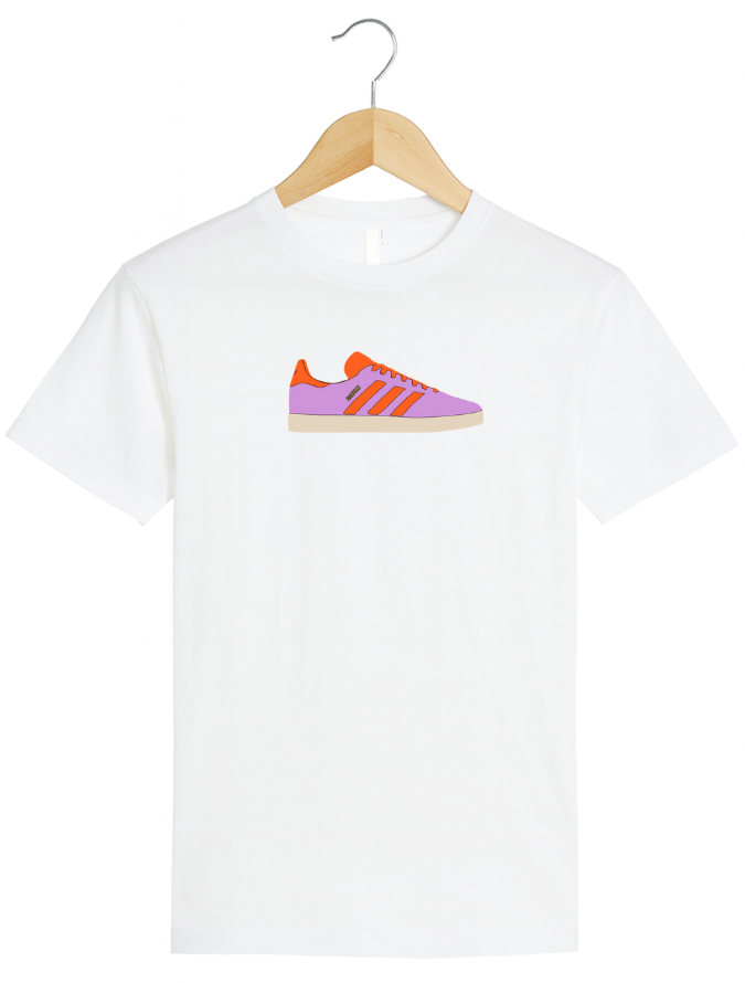White t-shirt with a colorful sneaker graphic on a hanger against a white background