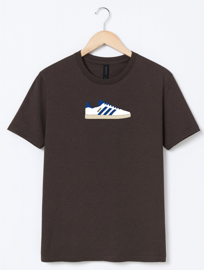 Brown t-shirt with a graphic of a sneaker on a hanger against a white background