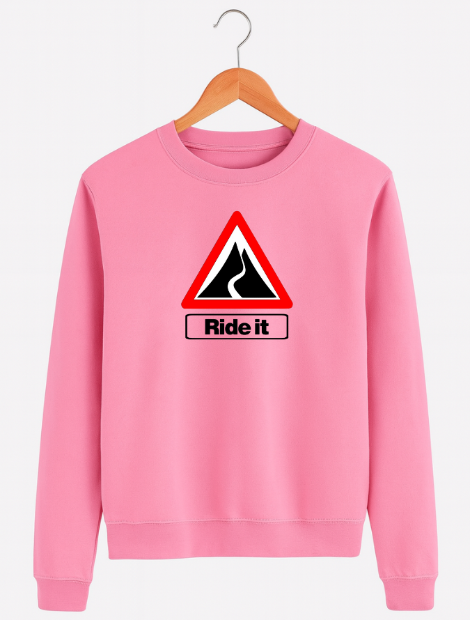 Pink sweatshirt with a road sign graphic and 'Ride it' text on a hanger against a white background