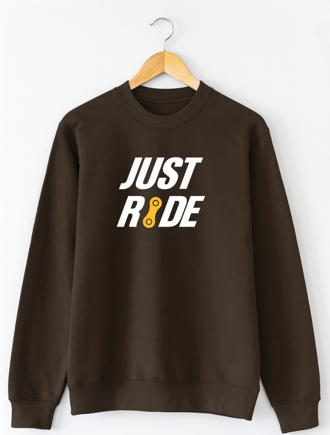 Brown sweatshirt with 'JUST RIDE' text on a hanger against a white background
