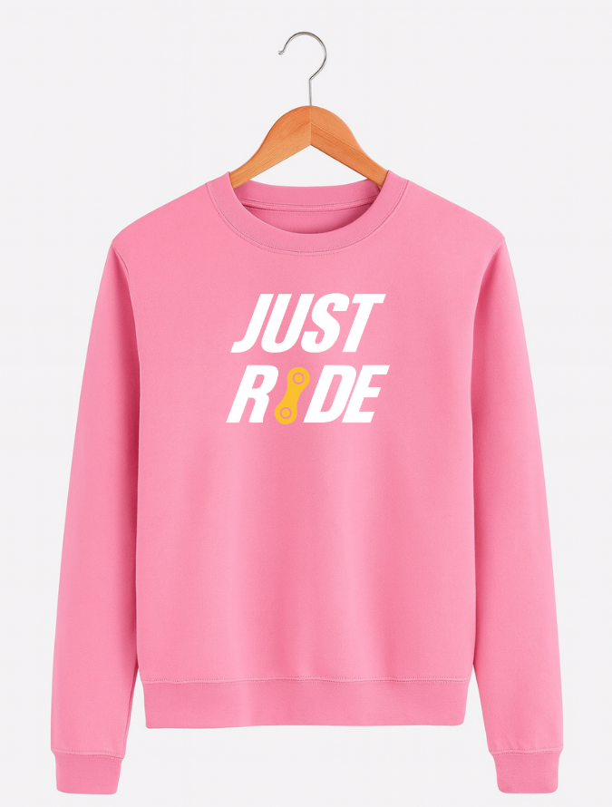 Pink sweatshirt with 'JUST RIDE' text on a hanger against a white background
