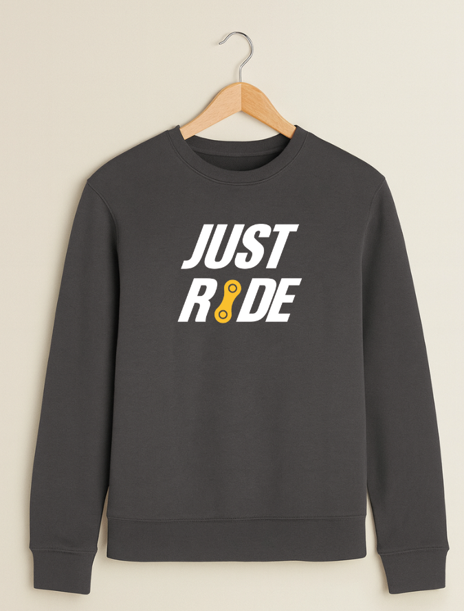 Grey sweatshirt with 'JUST RIDE' text on a beige background