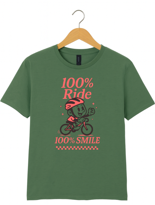 Green t-shirt with a graphic design of a person on a bike and text '100% Ride 100% Smile' on a hanger against a white background.